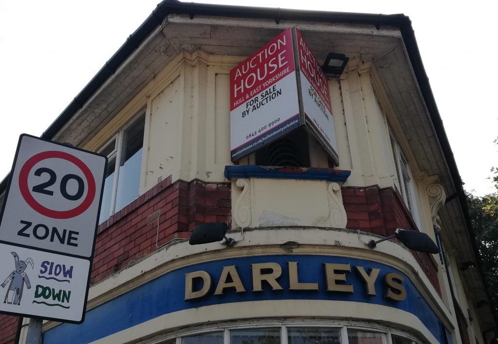 The Darley's pub with an auction house sign on the outside