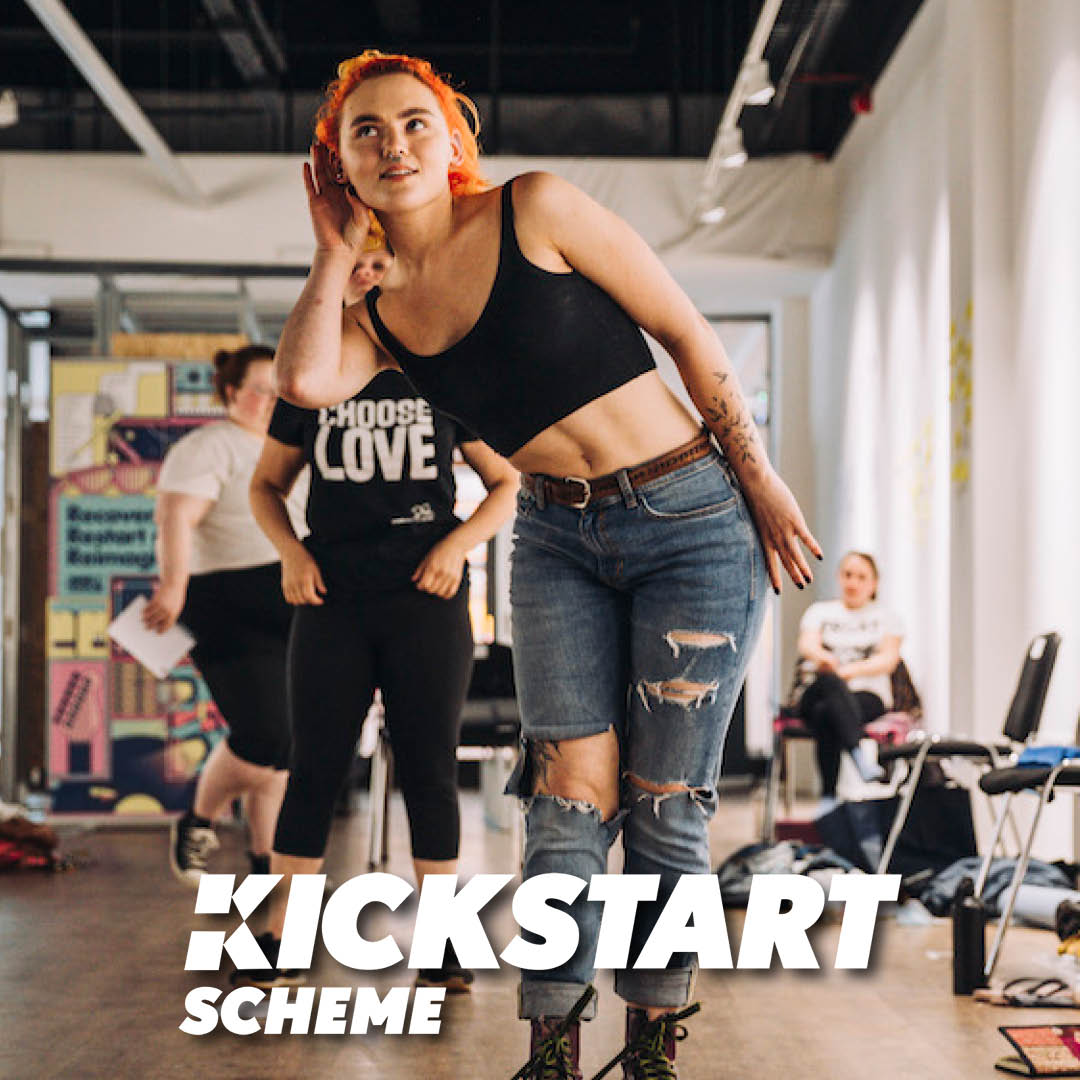 A young woman in a movement workshop with text that says "Kickstart Scheme"