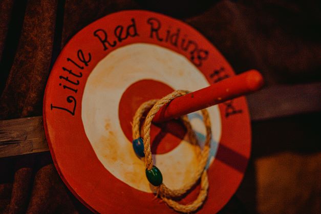 A red and white ring toss target that says Little Red Riding Hood